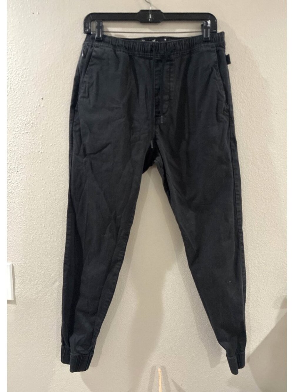 Hollister black men's jogger pants with an elastic drawstring waist cuffed hems
